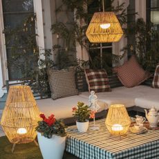 Outdoor living space with selection of outdoor lights with woven shades