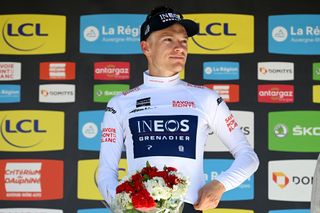 GAP FRANCE JUNE 10 Ethan Hayter of United Kingdom and Team INEOS Grenadiers celebrates winning the White Best Young Rider Jersey on the podium ceremony after the 74th Criterium du Dauphine 2022 Stage 6 a 1964km stage from Rives to Gap 742m WorldTour Dauphin on June 10 2022 in Gap France Photo by Dario BelingheriGetty Images