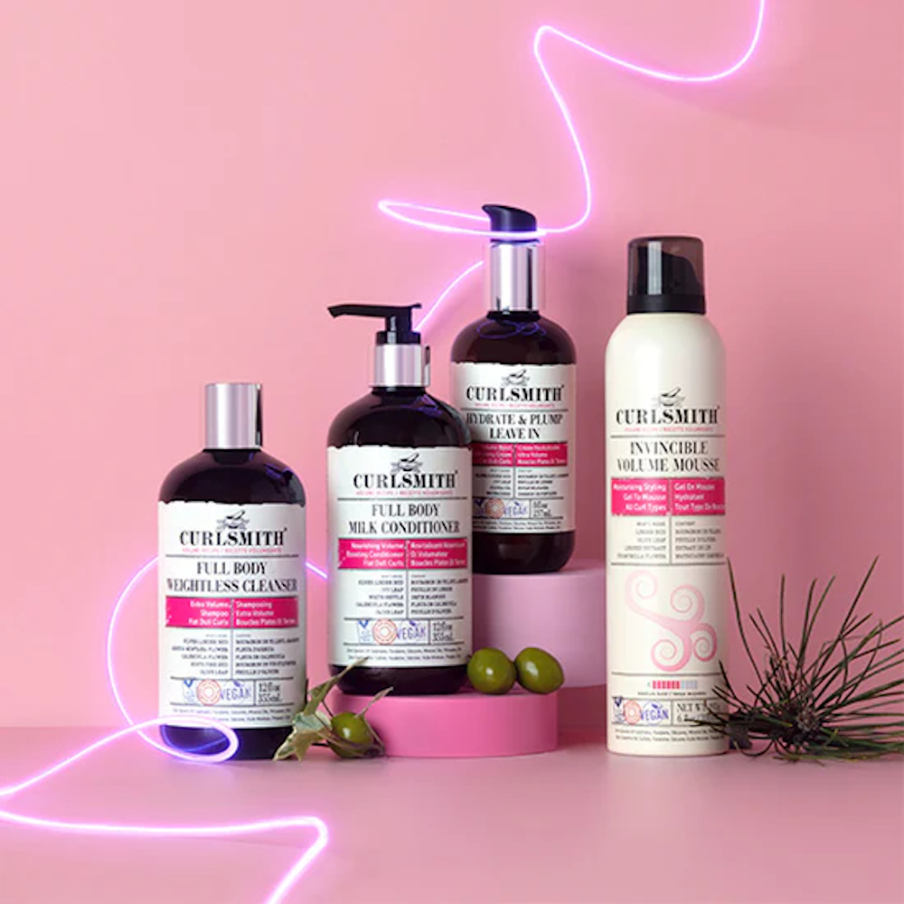 4 Curlsmith products on a pink background