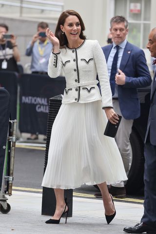 Kate Middleton wearing a white tweed Chanel jacket