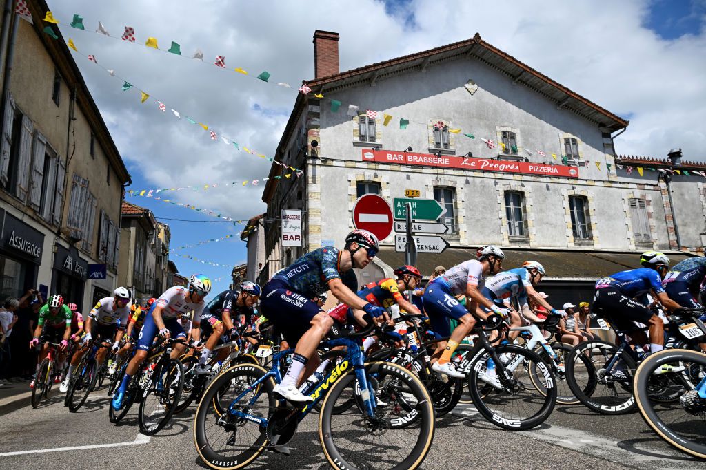 PAU FRANCE JULY 12 Wout Van Aert of Belgium and Team Visma Lease a Bike and a general view of the peloton competing at Nogaro village during the 111th Tour de France 2024 Stage 13 a 1653km stage from Agen to Pau UCIWT on July 12 2024 in Pau France Photo by Tim de WaeleGetty Images