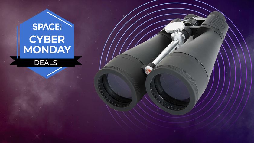 A pair of Celestron binoculars against a space background