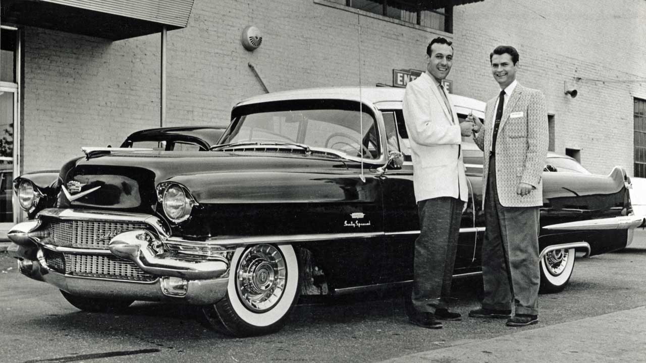 Sam Phillips presents Carl Perkins with a Cadillac outside Sun Studios