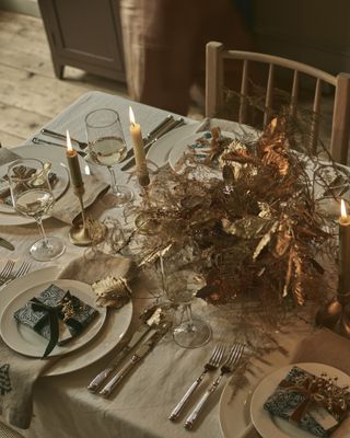 Christmas table with a gold foliage table centerpiece