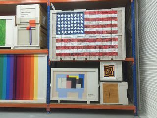 In the corner, a sizable star-spangled banner a la Jasper Johns hovers over smaller