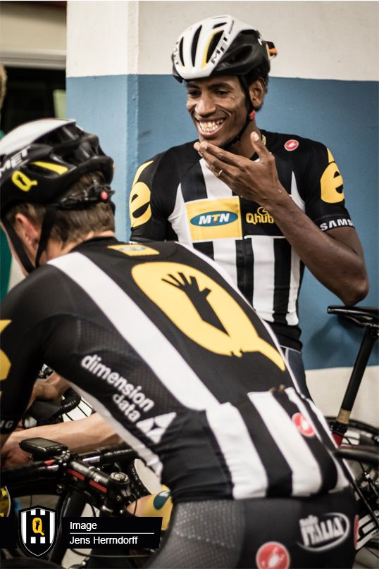 Daniel Teklehaimanot talks to his teammates