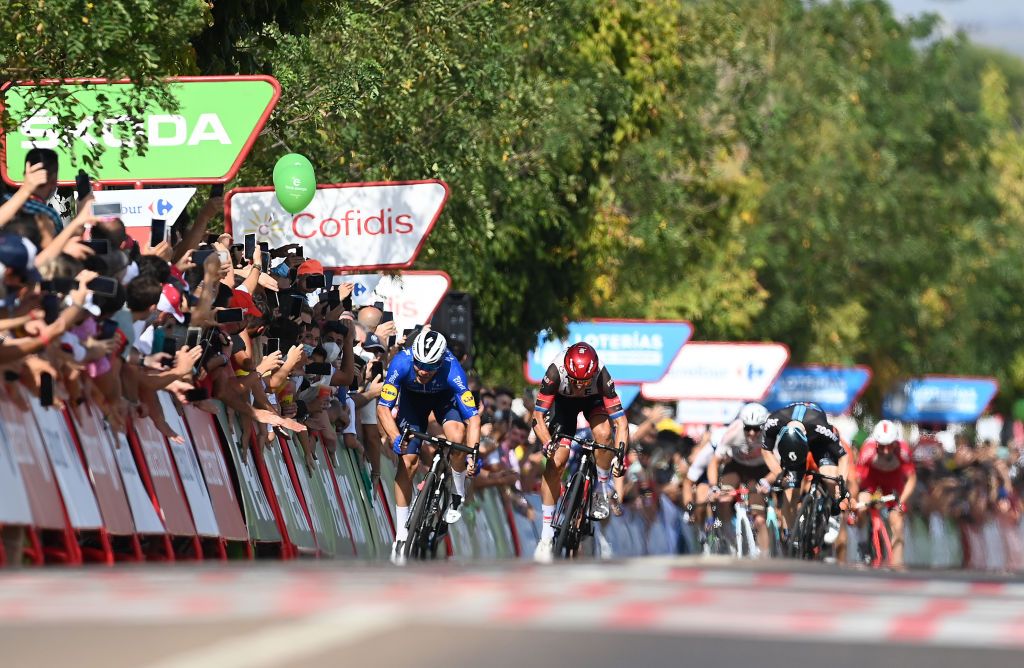 VILLANUEVA DE LA SERENA SPAIN AUGUST 27 LR Florian Senechal of France and Team Deceuninck QuickStep sprint to win ahead of Matteo Trentin of Italy and UAE Team Emirates during the 76th Tour of Spain 2021 Stage 13 a 2037km stage from Belmez to Villanueva de la Serena lavuelta LaVuelta21 on August 27 2021 in Villanueva de la Serena Spain Photo by Stuart FranklinGetty Images
