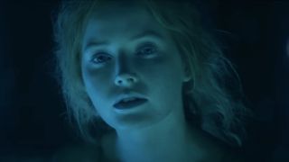 Ellie Bamber bathed in an eerie green light in Willow.