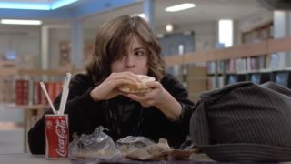 Alison from The Breakfast Club eating a sandwich