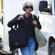 Sarah Jessie Parker wears cuffed jeans with high-top trainers.