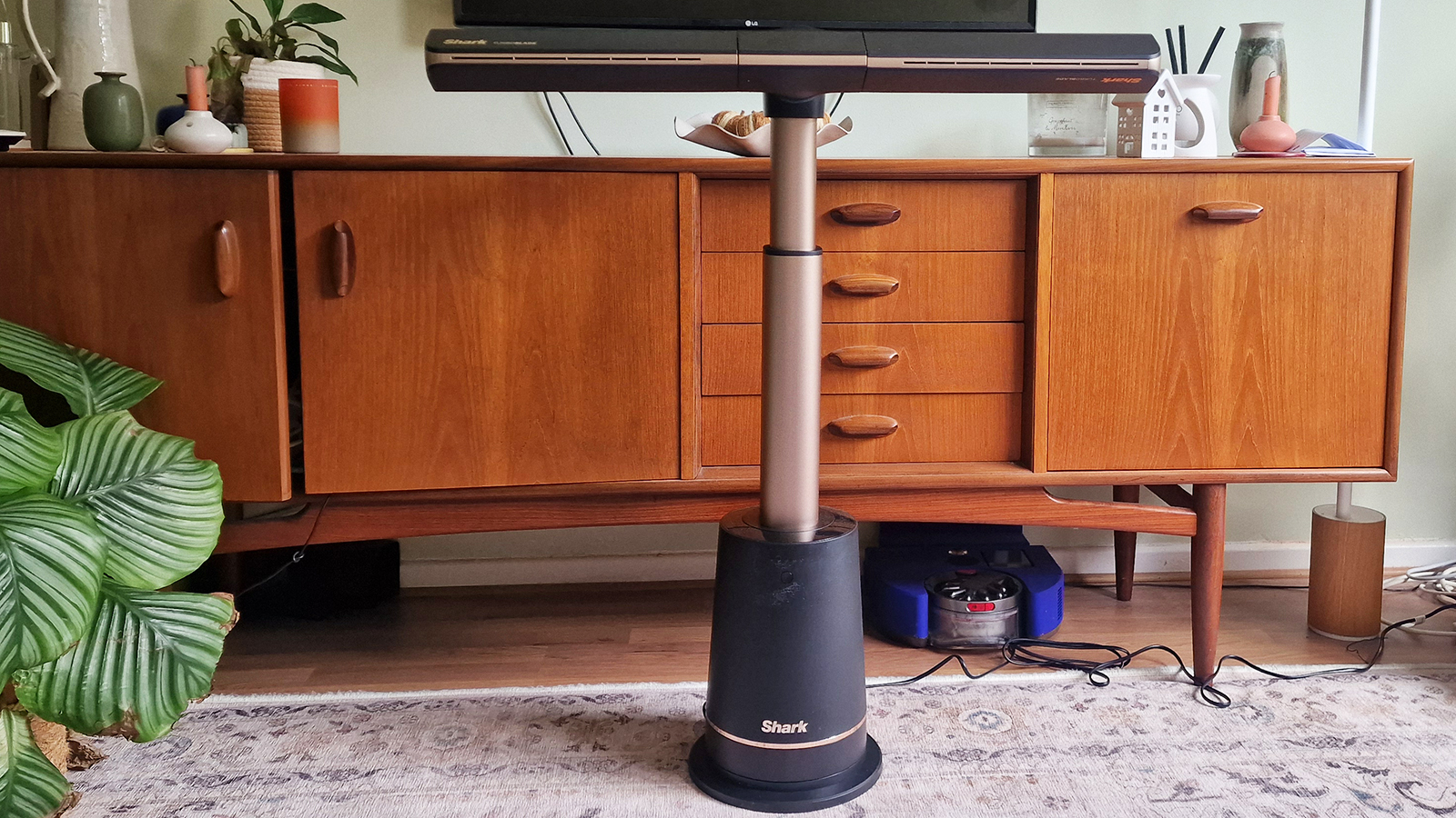 Shark TurboBlade in a living room in front of a walnut console