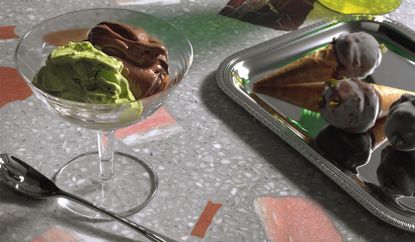 Pistachio and chocolate ice cream sit in a sundae glass and cones
