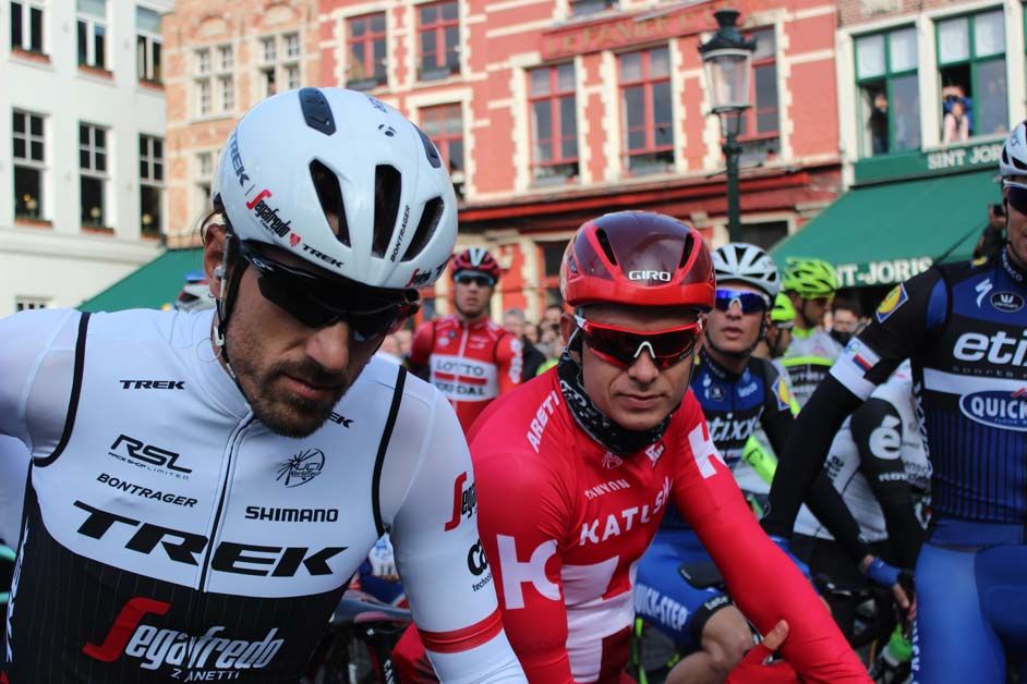 Defending champion Alexander Kristoff and three-time champion Fabian Cancellara sit next to each other at the start
