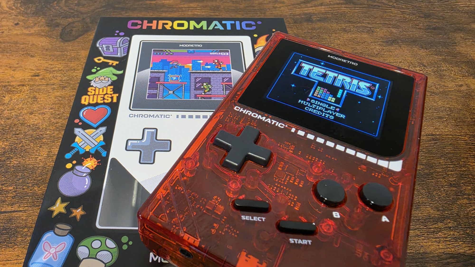 ModRetro Chromatic Transparent in red showing the Tetris start screen in the display