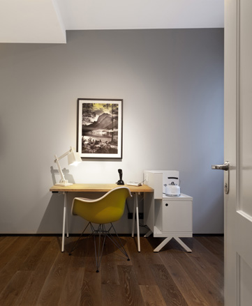 Desk with chair and lamp, side cabinet with kettle