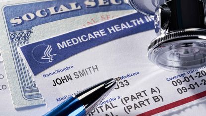 Medicare benefits card atop a Social Security benefits card