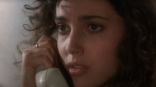 Ashley Laurence as Kirsty Cotton on the phone in Hellraiser