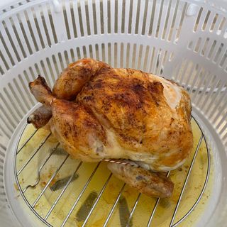 Image of halogen oven with cooked chicken