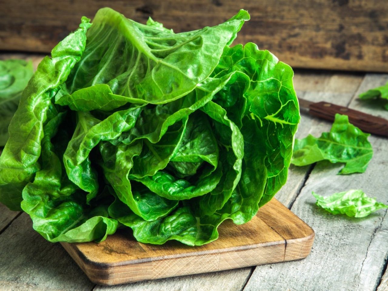 Green Lettuce On Wooden Cutting Board