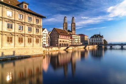 Historic cityscape of Zurich, Switzerland reflecting in Limmat River.