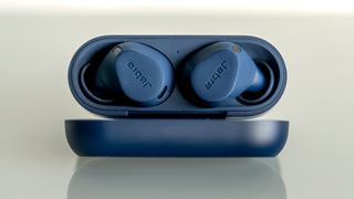 Jabra Elite 8 Active earbuds in case with lid open.