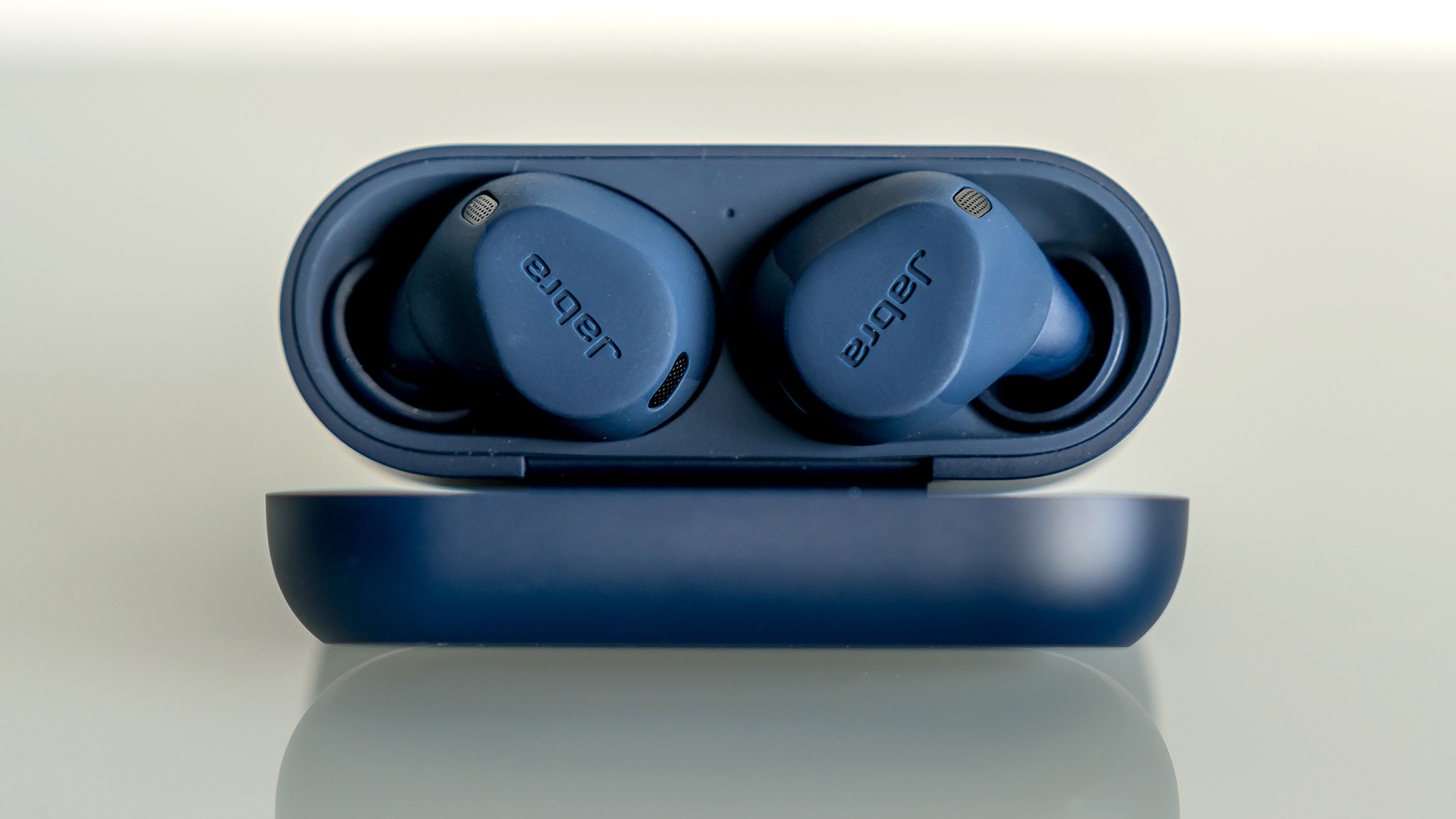 Jabra Elite 8 Active headphones in open-top case.