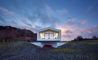 The house's long form was designed 'a bit like a telescope, or a horse's blinkers', explain the architects