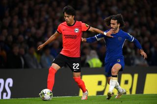 Kaoru Mitoma of Brighton & Hove Albion holds off Marc Cucurella of Chelsea during the Carabao Cup Third Round match between Chelsea and Brighton & Hove Albion at Stamford Bridge on September 27, 2023 in London, England.