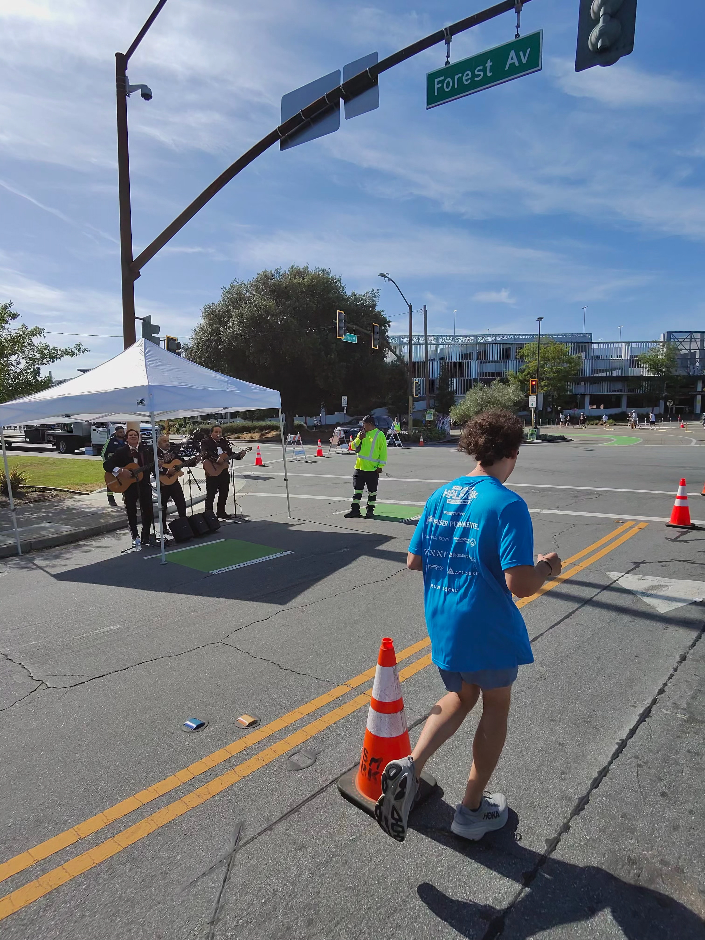 A Ray-Ban Meta smart glasses camera sample at the San Jose Half Marathon showing a mariachi band playing to the side of the course.