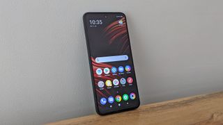 The Poco M3 Pro 5G from the front, on a table