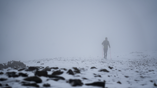 Tom Hollins climbs in the snow