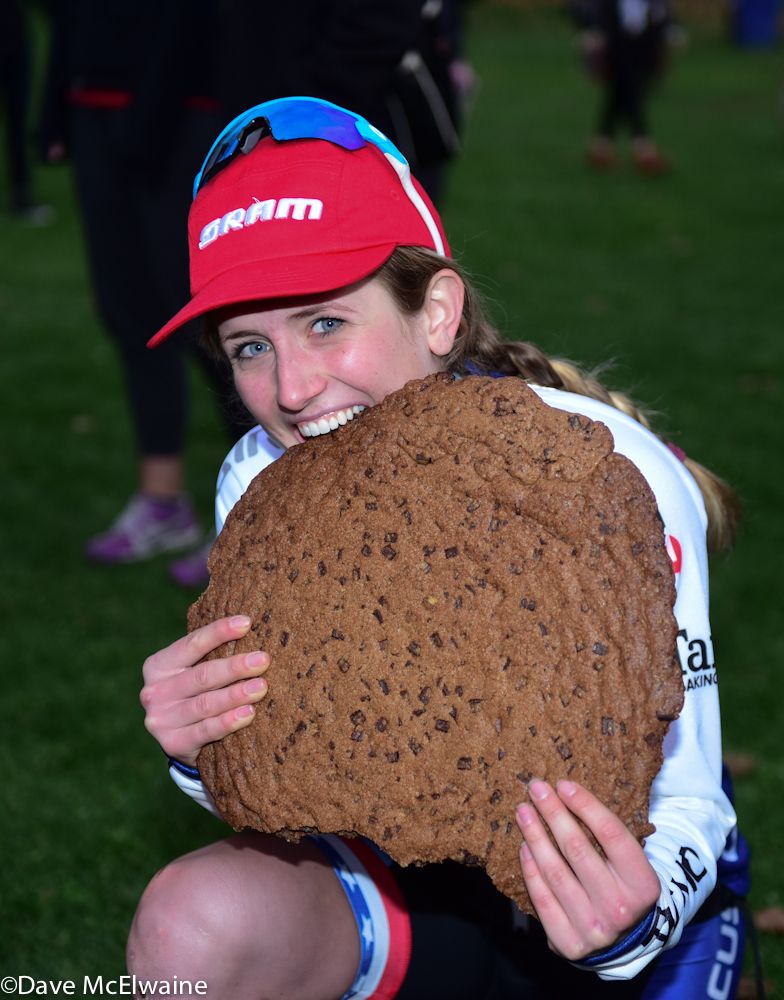 Ellen Noble (JAM/NCC/Vittoria) bites into the chocolate chip cookie that was given to the winner.
