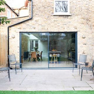 Exterior of sliding patio doors on brick property