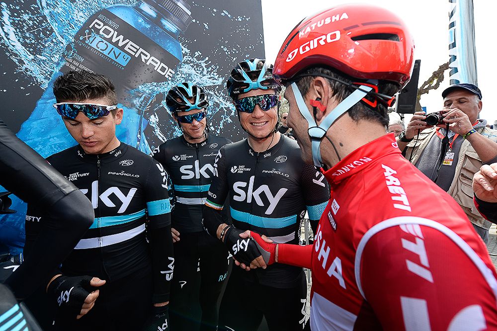 Joaquin Rodriguez greets the Team Sky riders