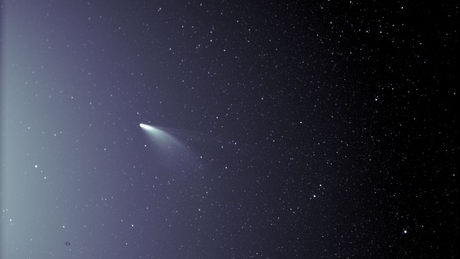 An unprocessed image from the WISPR instrument on NASA’s Parker Solar Probe shows Comet NEOWISE on July 5, 2020, shortly after its closest approach to the sun. The sun is out of frame to the left. The small black structure near the lower left of the image is caused by a grain of dust resting on the imager’s lens.