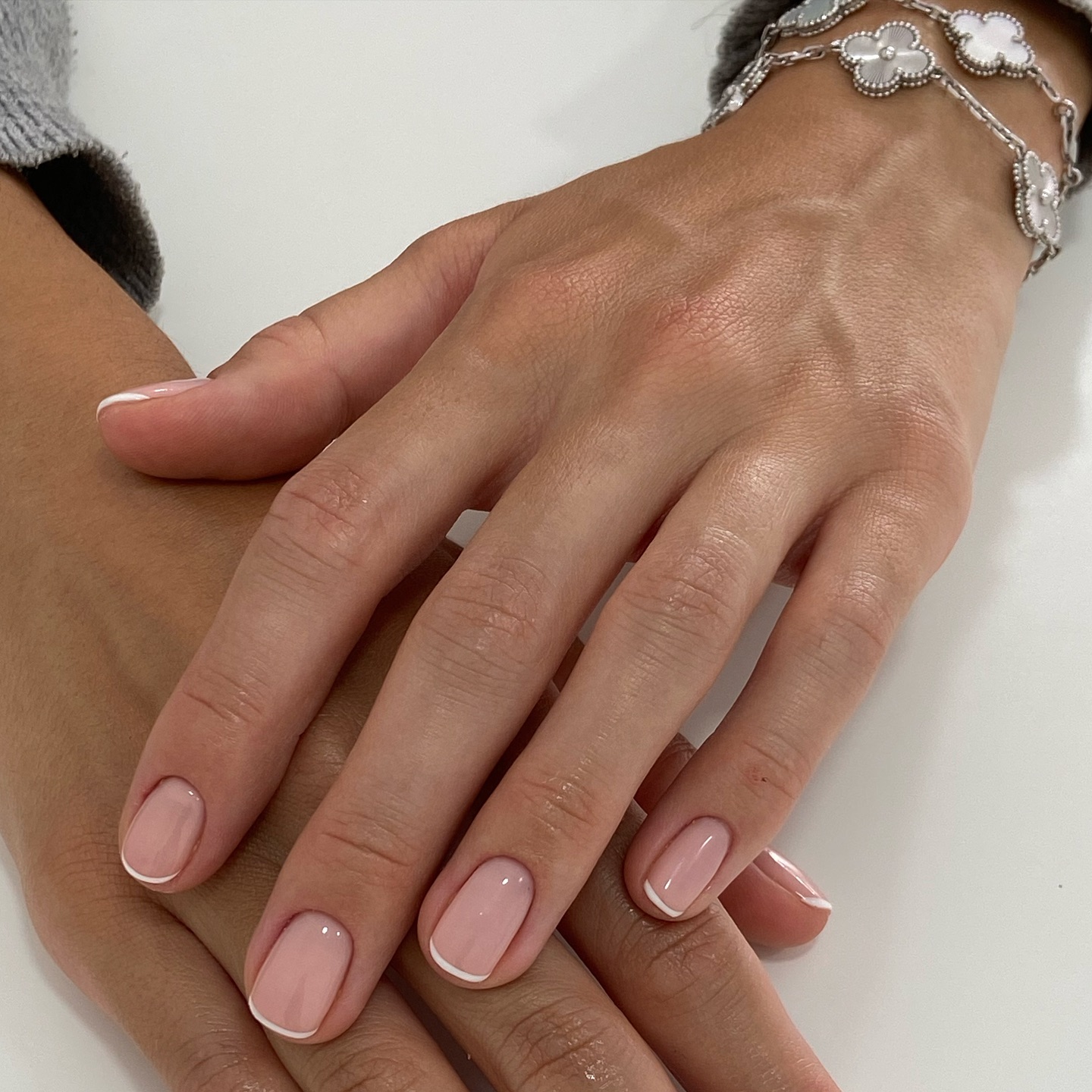 A milky French tip manicure