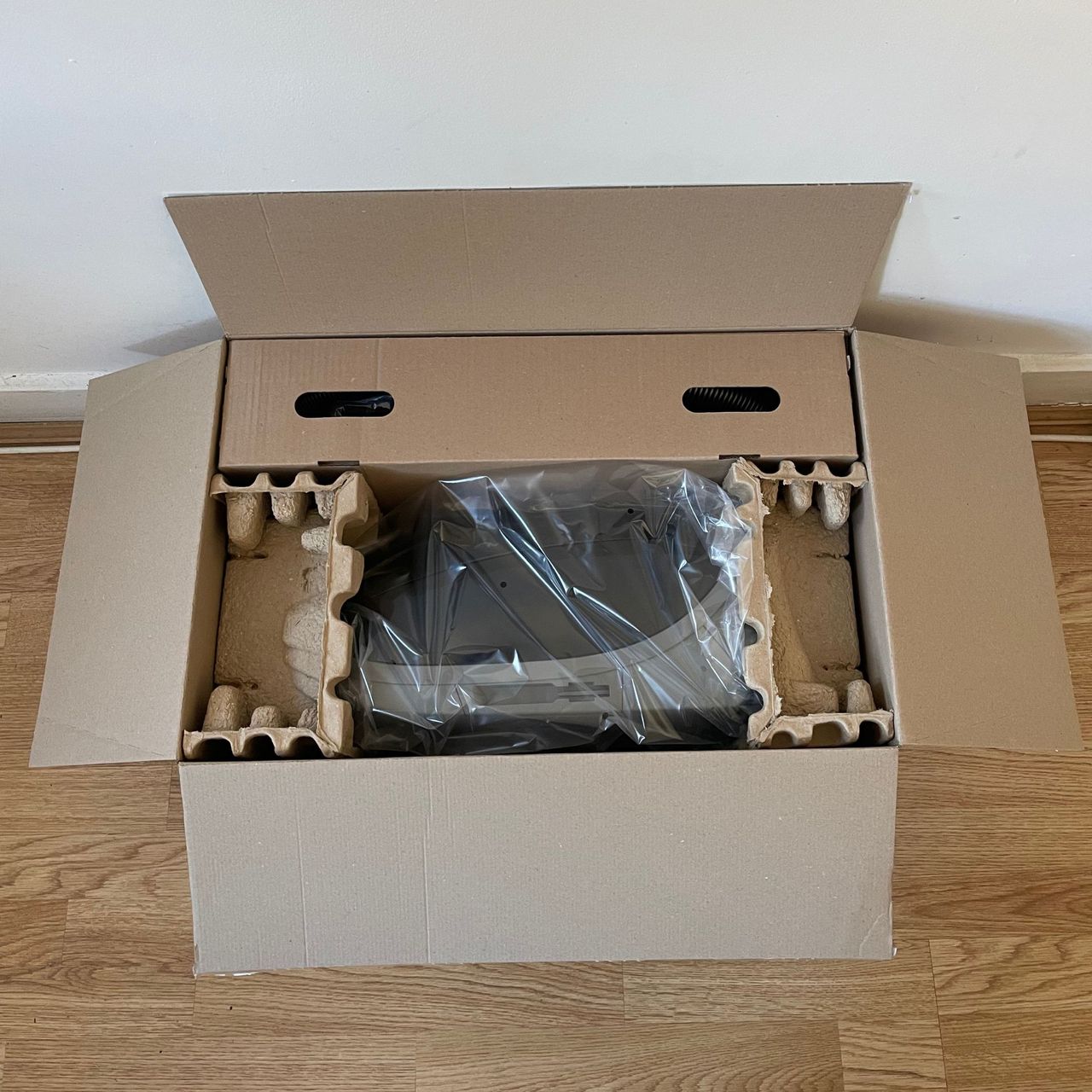Miele Guard M1 Cat &amp; Dog box with the lid open and the components still inside
