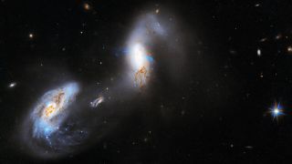 This new image from NASA’s Hubble Space Telescope shows interacting galaxies known as AM 1214-255