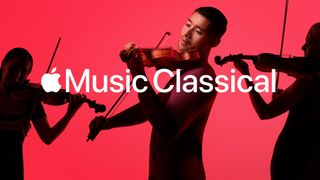 Violinists perform against red backdrop and white Apple Music Classical logo