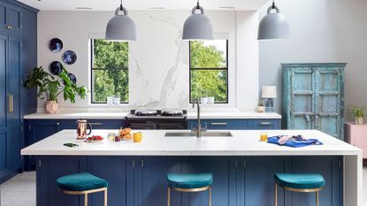 Automated lighting: Blue kitchen worktops with pendant lighting above