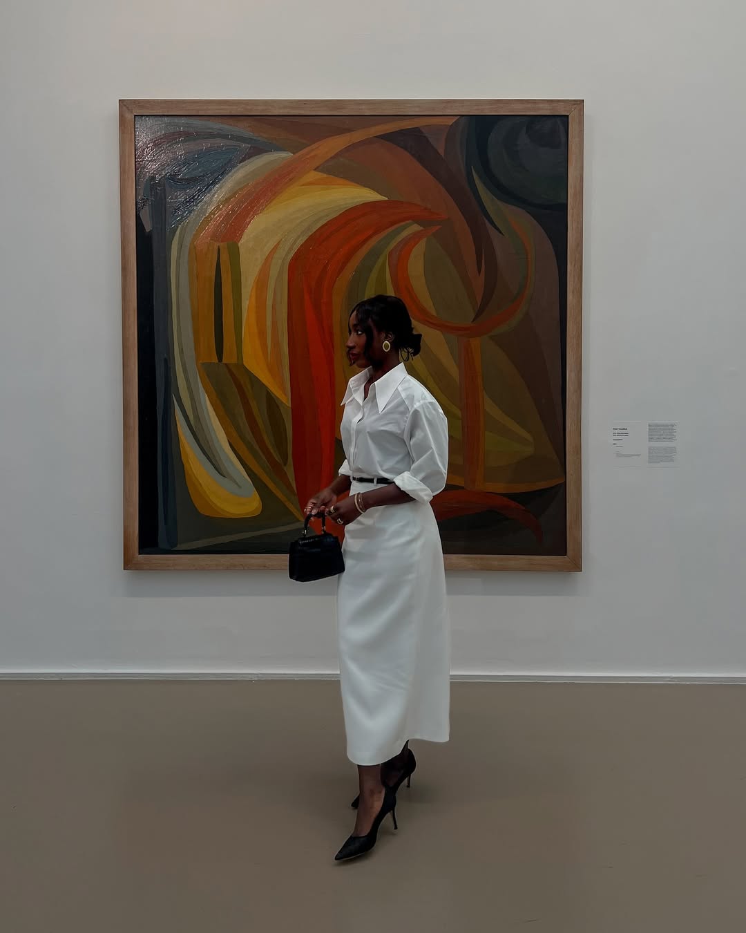 Adida in a white skirt and blouse