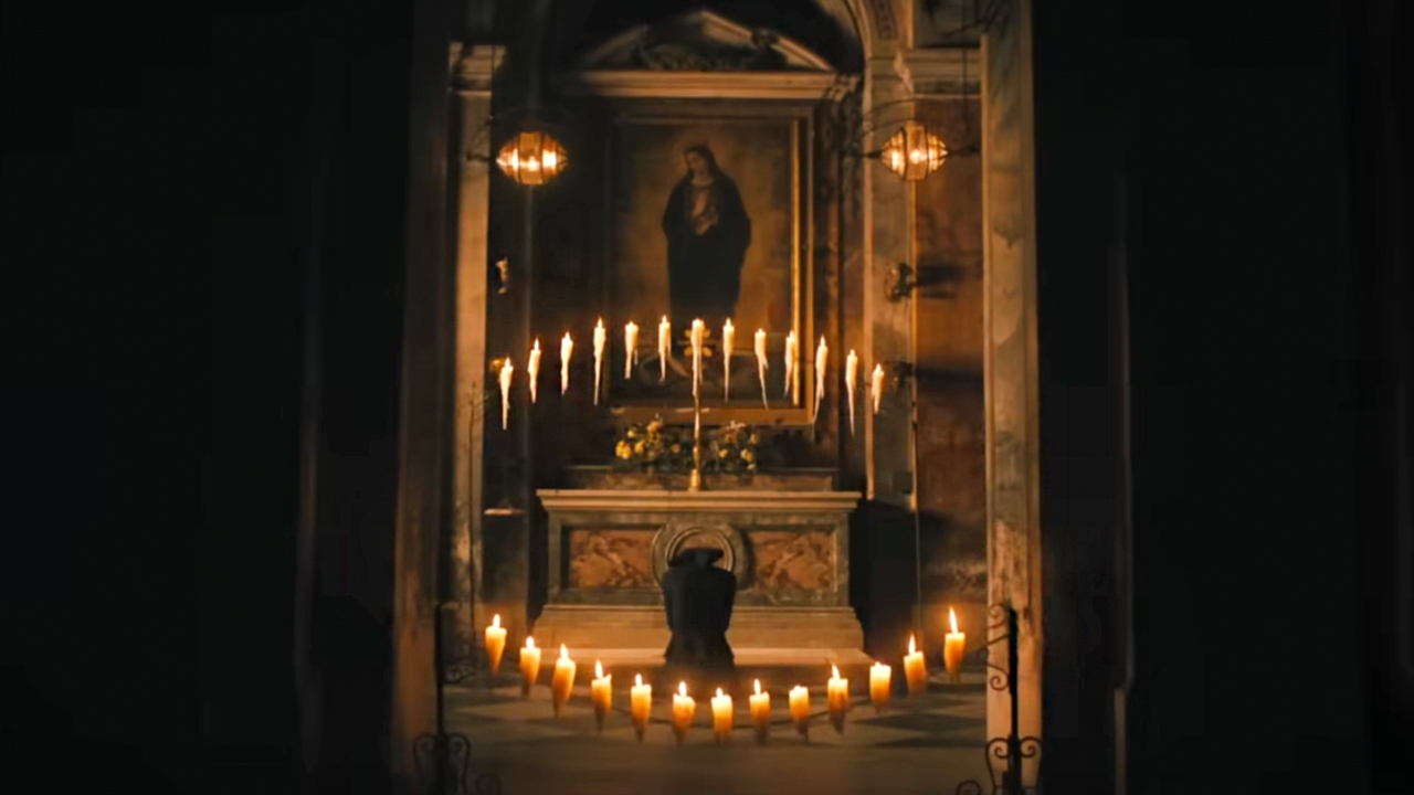 Margaret praying for salvation in The First Omen.
