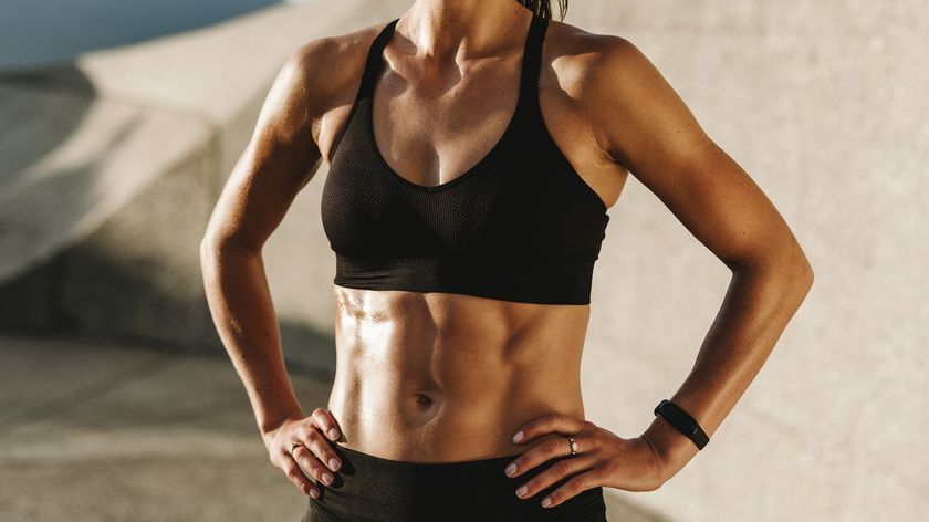 a photo of a woman with strong abs