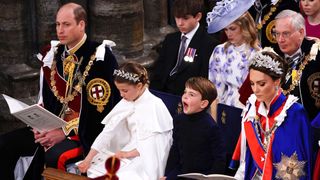 Prince Louis yawns at the Coronation of King Charles, sat with Prince William, Kate Middleton and Princess Charlotte