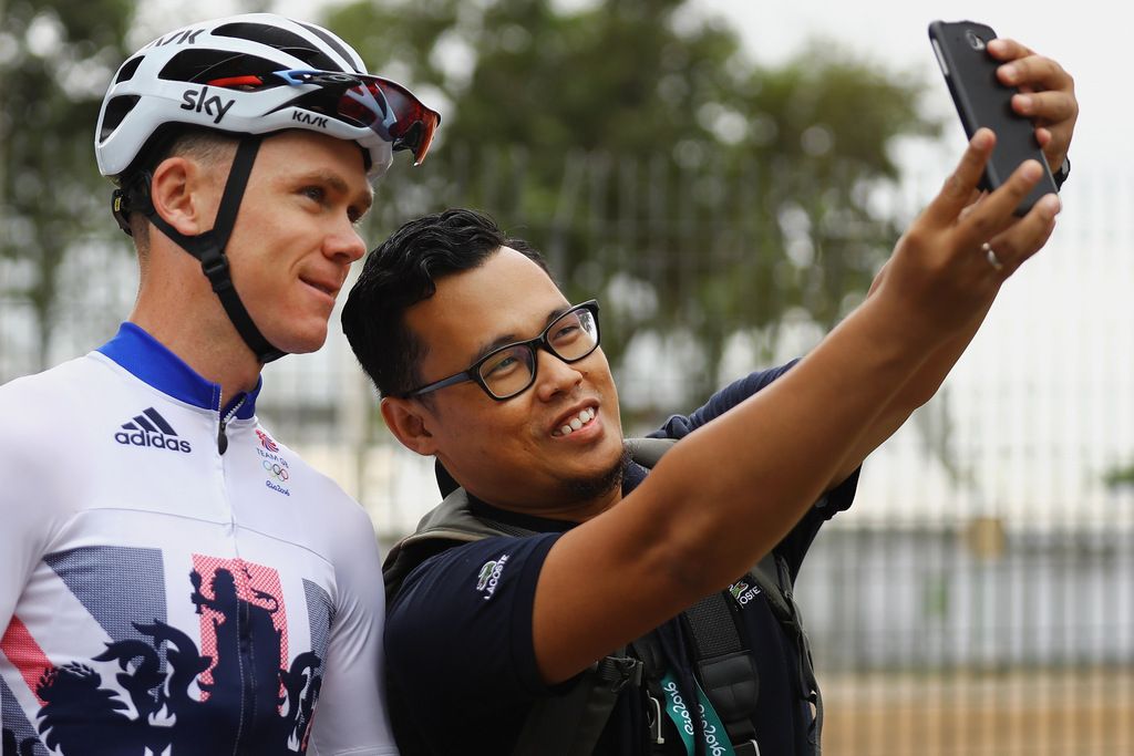 A fan gets a selfie with Chris Froome