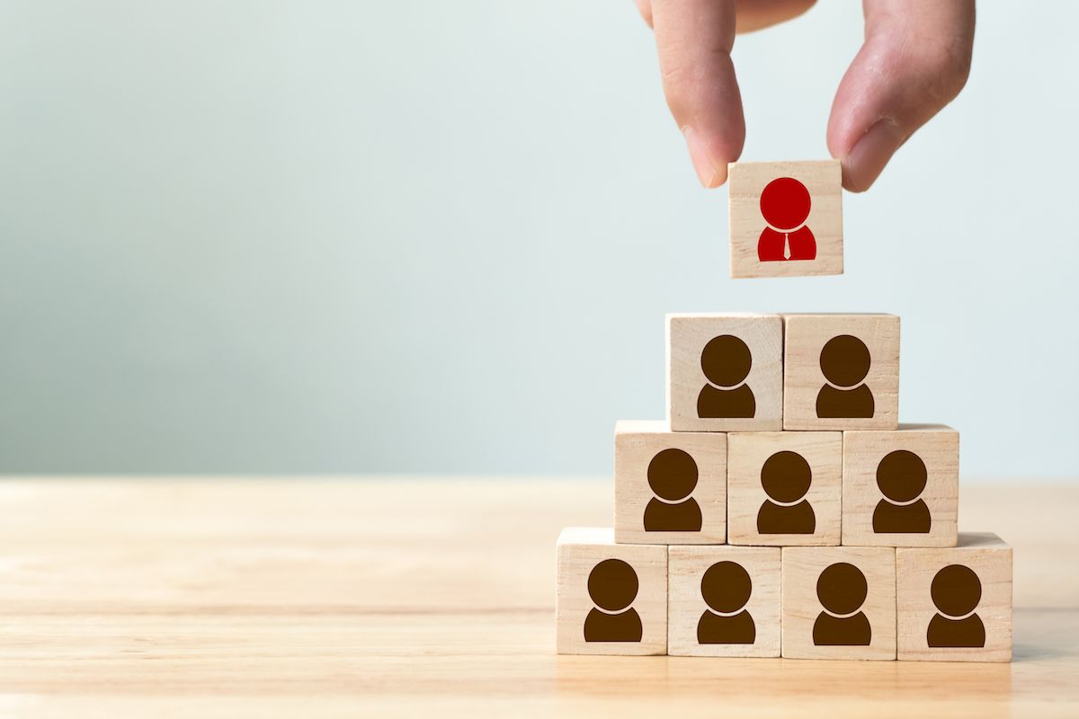 Recruitment of people represented as wooden blocks