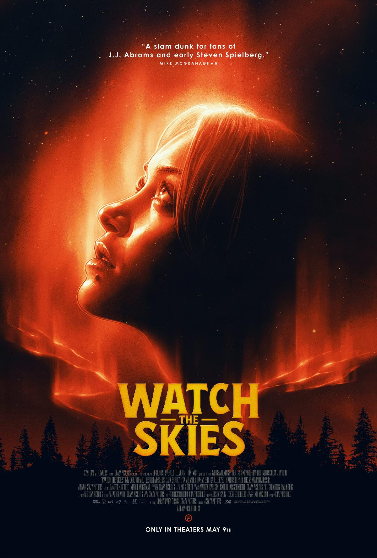 A poster of a teenage girl staring upward into a shimmery red sky