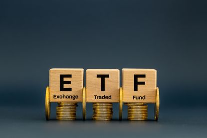 ETF exchange traded fund on wood blocks