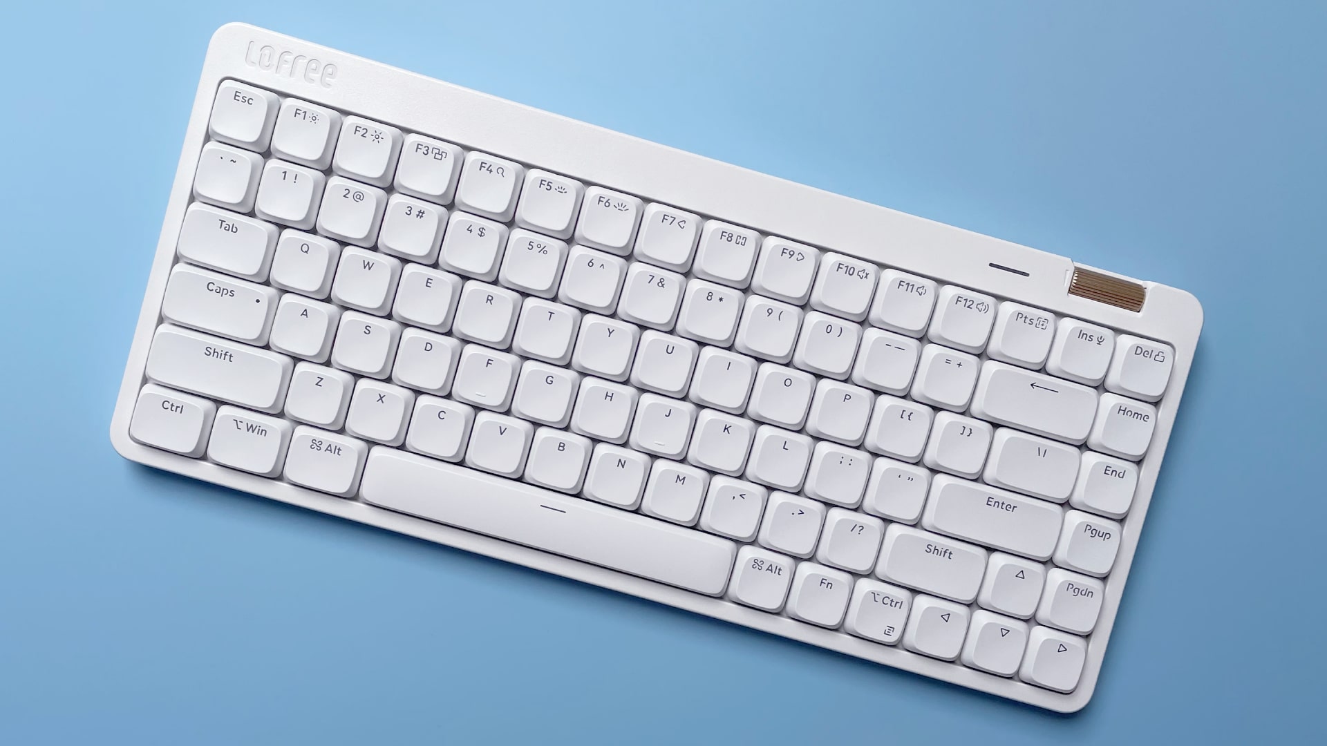 The Lofree Flow Lite mechanical keyboard against a blue background.