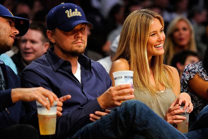 LOS ANGELES, CA - APRIL 27: Actor Leonardo DiCaprio and girlfriend model Bar Refaeli sit courtside during Game Two of the Western Conference Quarterfinals of the 2010 NBA Playoffs between the Los Angeles Lakers and the Oklahoma City Thunder at Staples Center on April 27, 2010 in Los Angeles, California. (Photo by Kevork Djansezian/Getty Images)